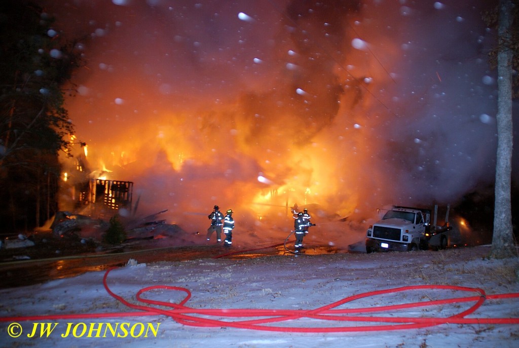 Snow Falls As Firefighters Work Their Way In